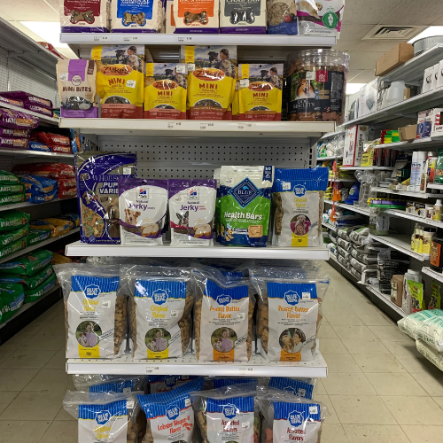 Dog food and supplies displayed inside of B'Ville Supply.
