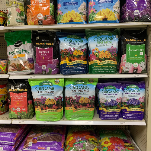 Lawn and garden supplies displayed inside of B'Ville Supply.