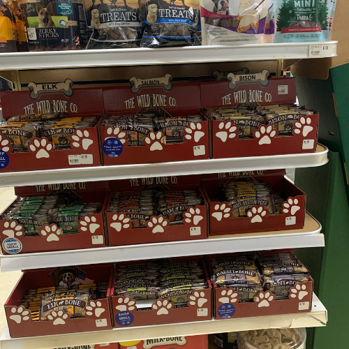 Dog food and supplies displayed inside of B'Ville Supply.
