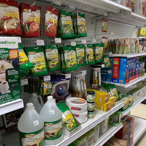 Lawn and garden supplies displayed inside of B'Ville Supply.